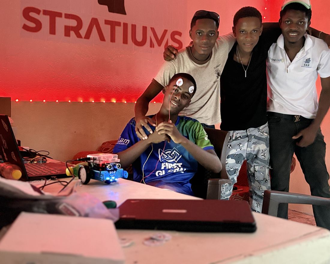 Students in an AI and robotics workshop at Stratiums Technologies, Jacmel