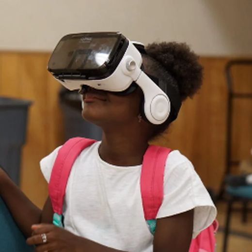 A student wearing a VR headset during a Virtual Reality Program session